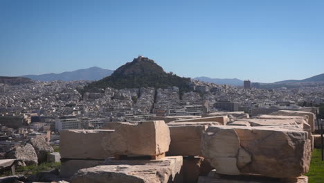 Panoramic-view-of-Athens-city-from-the-Acropolis,-with-distant-hills-and-mountains-under-a-clear-sky