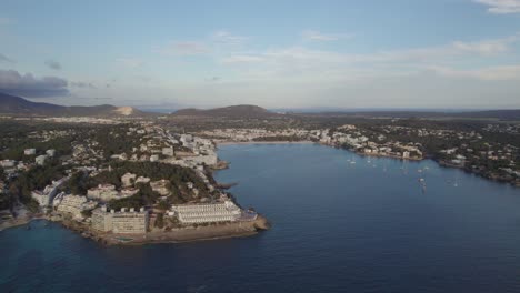 Hotel-Buildings-And-Beach-At-Sunset-In-Coastal-Town-Of-Santa-Ponsa-On-Balearic-Islands,-Mallorca,-Spain