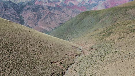 Aerial-establishing-shot-revealing-the-large-mountainside-at-the-hill-of-14-colors