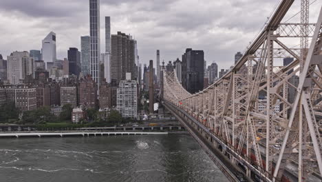 NYC-New-York-Aerial-v325-drone-flyover-Queensboro-bridge-over-East-river-towards-Sutton-Place-capturing-cityscape-of-Midtown-Manhattan-and-Lenox-Hill---Shot-with-Mavic-3-Pro-Cine---September-2023