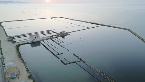 Saline-di-Trapani-Top-Aerial,-Wet-Watered-Salt-Fields-pond-Landscape-in-Sicily-Italy