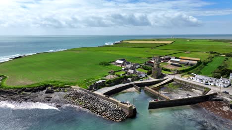 Ireland-Epic-locations-the-little-pretty-fishing-harbour-of-Sladewith-Hook-Lighthouse-and-Slade-Castle-in-the-harbour,beauty-spot-in-Wexford