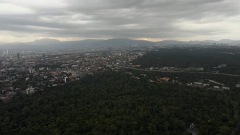 Chapultepec-park-in-Mexico-City,-wide-landscape-aerial-drone,-cloudy-afternoon