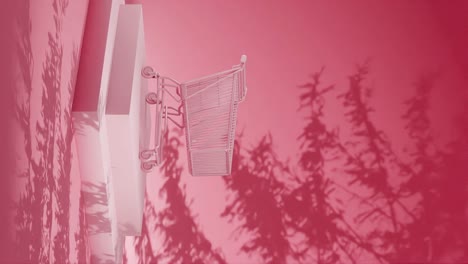 Empty-shopping-cart-on-a-red-platform-with-shadow-of-branches-on-a-red-background