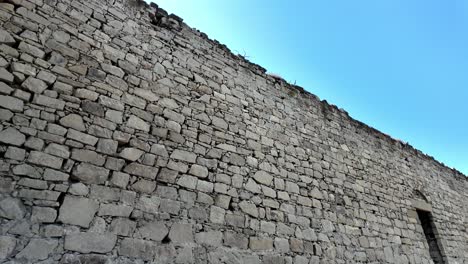 A-low-angle-view-of-the-stone-walls-of-the-Genoese-Fortress-in-Feodosia,-Russia