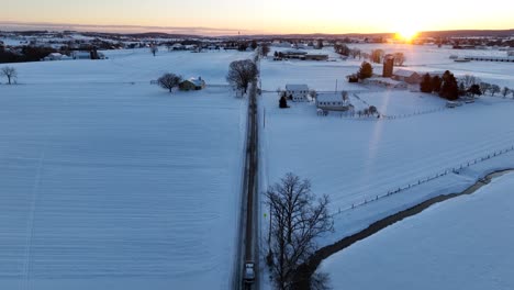 Car-on-Road-on-rural-street-in-countryside-farmland-of-American-town