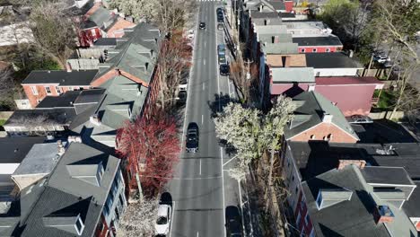 Aerial-birds-eye-shot-of-cars-on-road-on-american-neighborhood