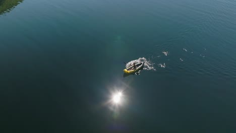 Person-kayaking-in-a-serene-lake-in-Røldal,-Norway