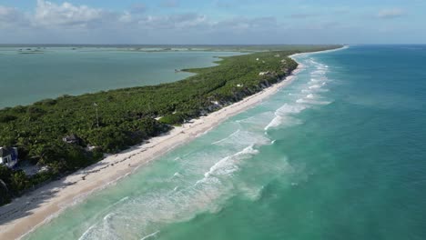 Aerial:-Caribbean-waves-wash-ashore-on-beach-at-Sian-Ka'an-bioreserve