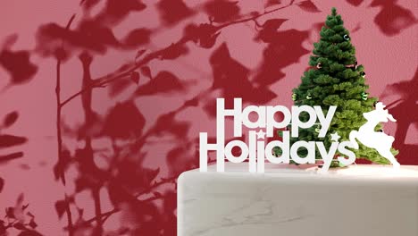 Small-Christmas-tree-with-"Happy-Holidays"-sign-on-marble-platform-with-red-floral-shadow-background