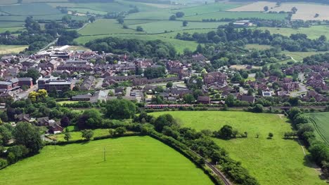 Train-moving-through-the-countryside-filmed-from-above-with-a-drone