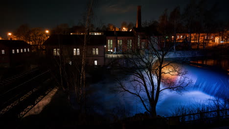 Time-lapse-of-the-illuminated-Vanhankaupunginkoski-dam,-spring-night-in-Helsinki