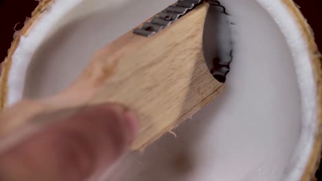 Hand-Grating-Coconut-Meat,-Close-Up