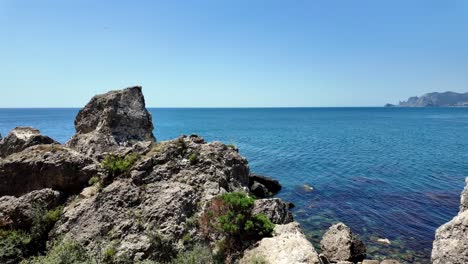 A-picturesque-view-of-the-Black-Sea-from-a-rocky-cliff-in-Sudak,-Crimea,-Russia