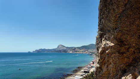 A-stunning-view-of-Sudak-Bay-in-Crimea,-Russia,-captured-from-a-cliff-on-a-sunny-day