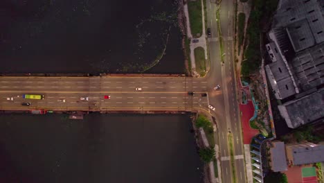 Aerial-Top-View-of-Floating-Bridge-over-Ozama-River-in-Colonial-City-of-Santo-Domingo,-Dominican-Republic