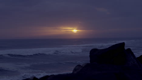 Cloudy-Sun-set-in-rainy-day-view-from-beach-and-rocks