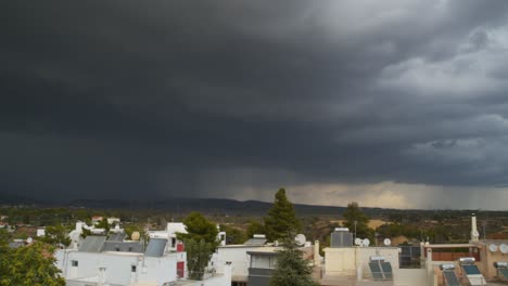 Right-pan-wide-panoramic-shot-of-massive-amount-of-thunderstorm-clouds,-over-Parnitha-mountain,-Greece