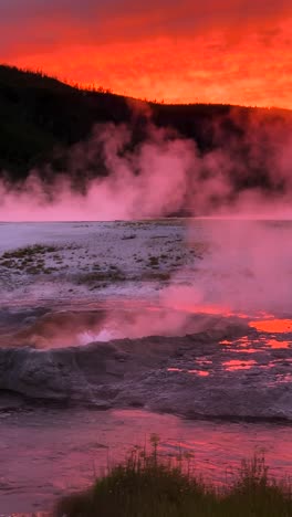 Vertical-4k,-Sunset-Over-Vapor-of-Geothermal-Hot-Springs-in-Yellowstone-National-Park,-Wyoming-USA