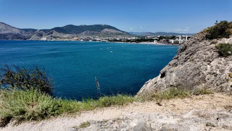 A-view-of-the-coastline-from-a-clifftop-in-Sudak,-Crimea,-Russia