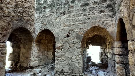 The-interior-of-the-Genoese-Fortress-in-Feodosia,-Russia,-showcasing-the-intricate-stonework-and-arches-of-the-ancient-structure