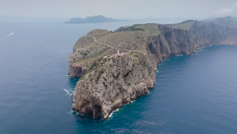 Incredible-aerial-view-of-limestone-archipelago-with-lighthouse,-Mallorca