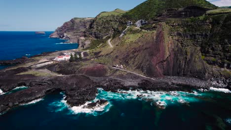 Ariel-shot-of-seashore-of-São-Miguel-Island-in-Portugal,-beautiful-houses-at-the-center