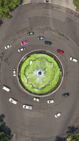 Diana-the-Huntress-Fountain-on-Paseo-de-la-Reforma-in-aerial-hyperlapse,-CDMX