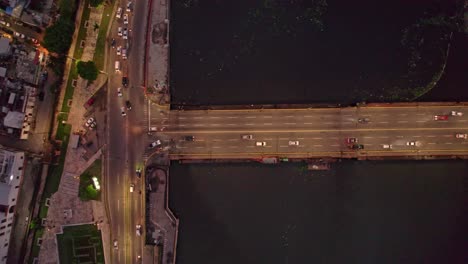 Aerial-Top-View-over-Floating-Bridge,-Ozama-River-in-Colonial-City-of-Santo-Domingo,-Dominican-Republic