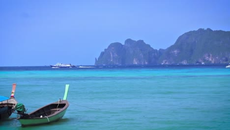 Fisherman-boats-parked-on-side-and-bouncing-on-the-calm-blue-waters