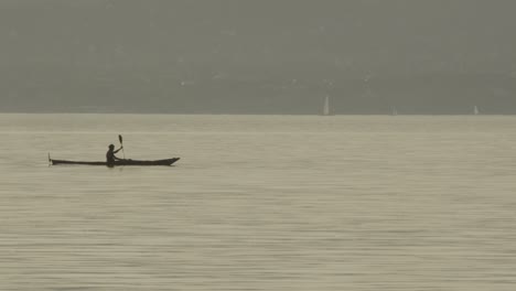 A-man-crossing-with-his-canoe-on-Lake-Balaton