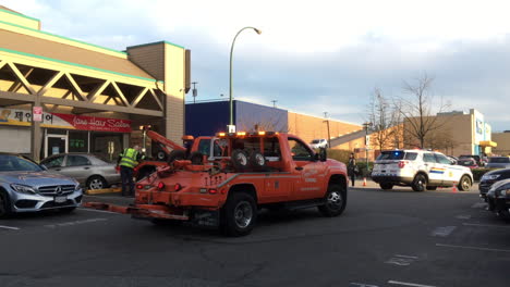 Motion-of-red-and-blue-emergency-lights-of-police-cars-and-tow-car-on-road-for-car-accident-scene-with-4k-resolution