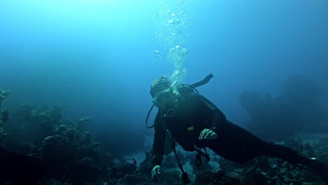 Scuba-diver-at-the-bottom-of-the-sea-showing-OK-sign