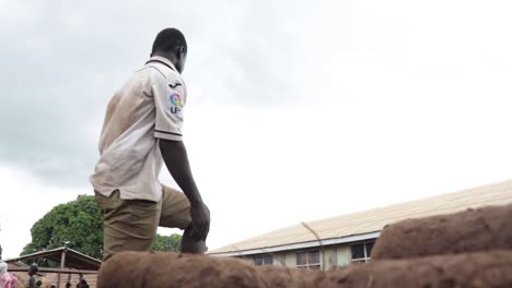 Boy-packing-yam-into-truck