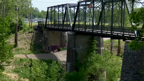 Old-pedestrian-bridge-over-river