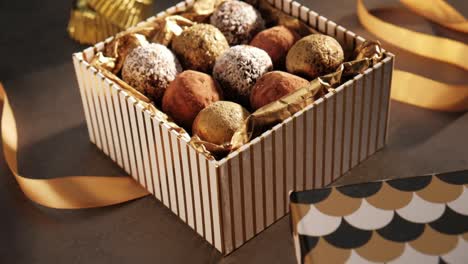 Slowmotion-camera-slide,-variety-of-truffles-in-a-gift-box