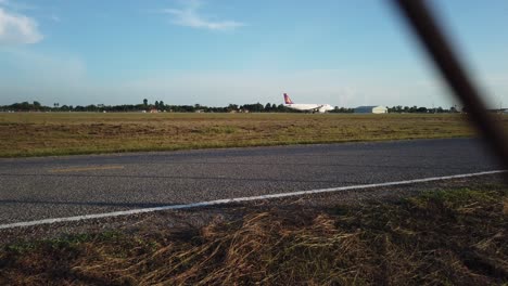 Tracking-shot-of-airplane-taking-off-on-the-runway-in-siem-reap-international-airport-in-4k