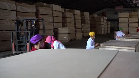 Wood-industry:-Factory-workers-processing-the-plywood