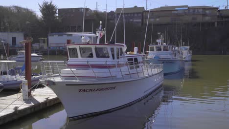 Boats-docked-in-Depoe-Bay,-the-worlds-smallest-Harbor