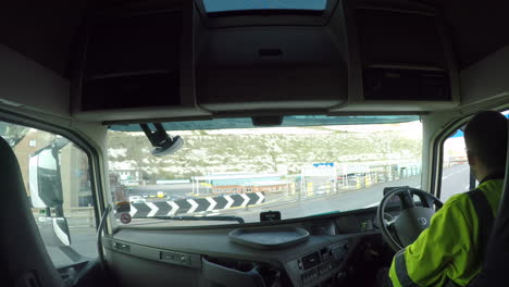 HGV-Driver-on-the-exit-ramp,-leaving-the-Port-Of-Dover,-UK