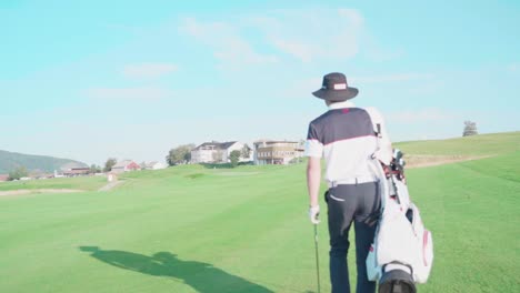 Following-golfer-walking-towards-clubhouse