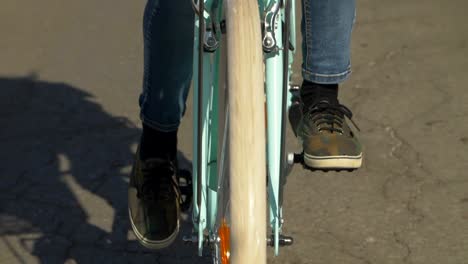 Revolving-wheels-of-a-turquoise-bicycle