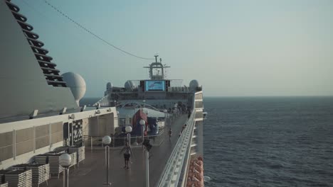 Static-shot-of-large-cruise-liner-sailing-through-the-Indian-Ocean-as-the-sun-sets