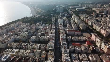 City-overfly-buildings-road-and-sea