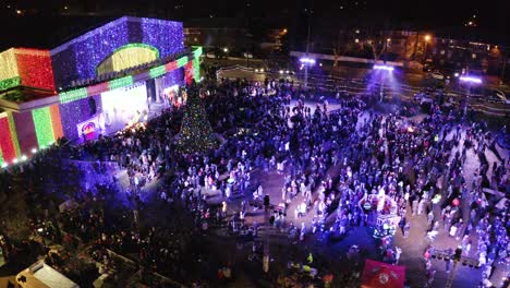 Aerial-point-of-interest-shot-around-the-Fort-Lee-Tree-Lighting-ceremony-in-New-Jersey-during-Christmas