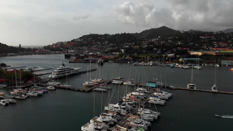 A-launch-parking-next-to-a-yacht-in-the-Harbour-located-in-the-Caribbean