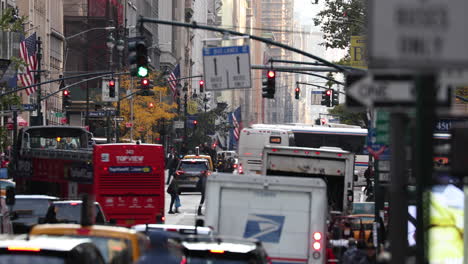 Tourist-open-top-bus-slowly-makes-his-way-in-the-traffic