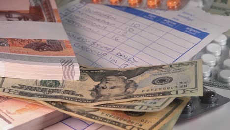 Close-Shot-of-Medical-Prescription-with-Over-the-Counter-Drugs-and-Bank-Notes