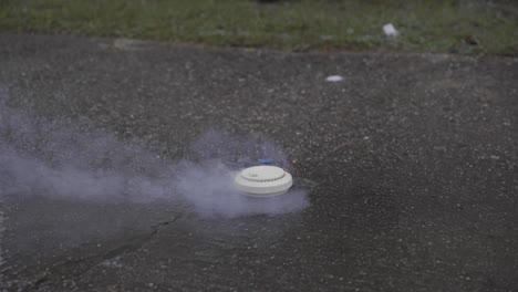 Smoke-Detector-on-Fire-and-Smoking-Outside-in-Slow-Motion-Destruction