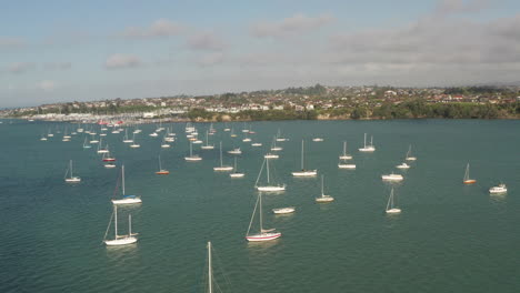 Ocean-overflight-above-yachts,-boats-in-harbour,-aerial-shot